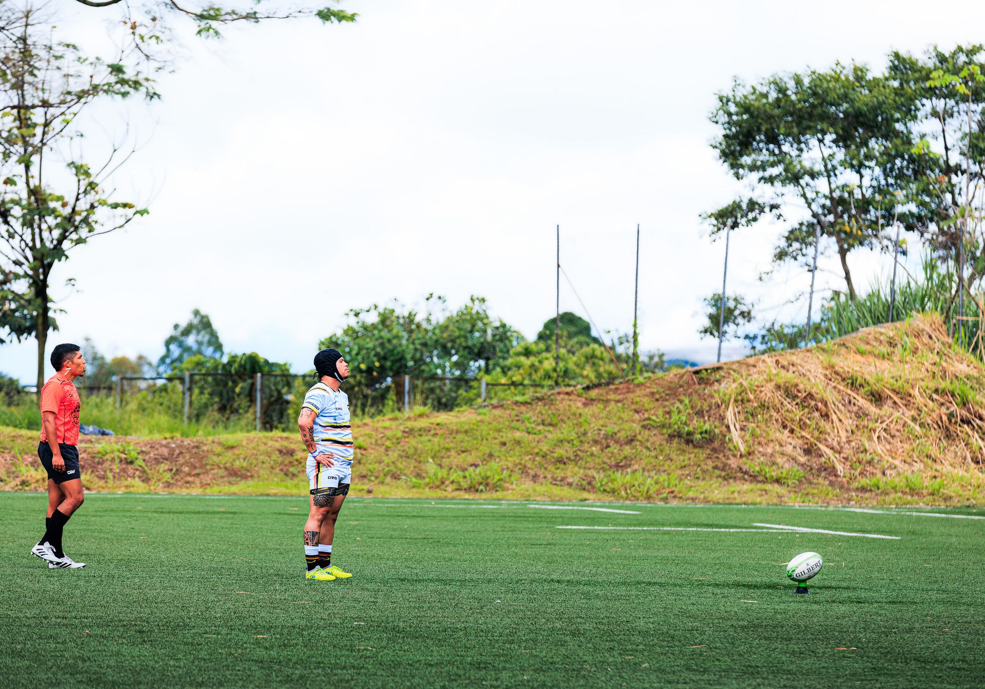 Rugby players on a field during a return-to-sport training session